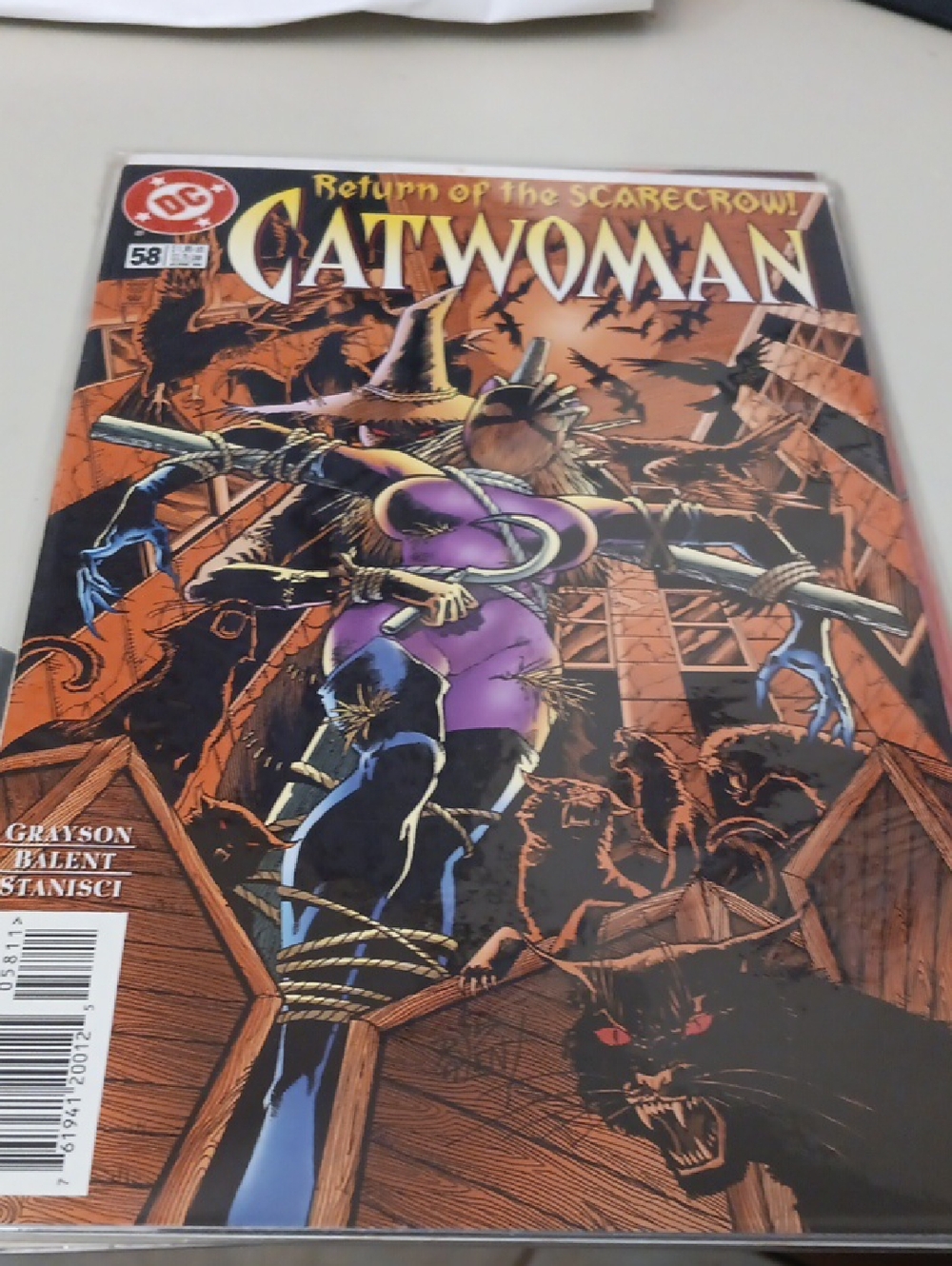 DC Catwoman Comic — Purple & Black with Orange Background